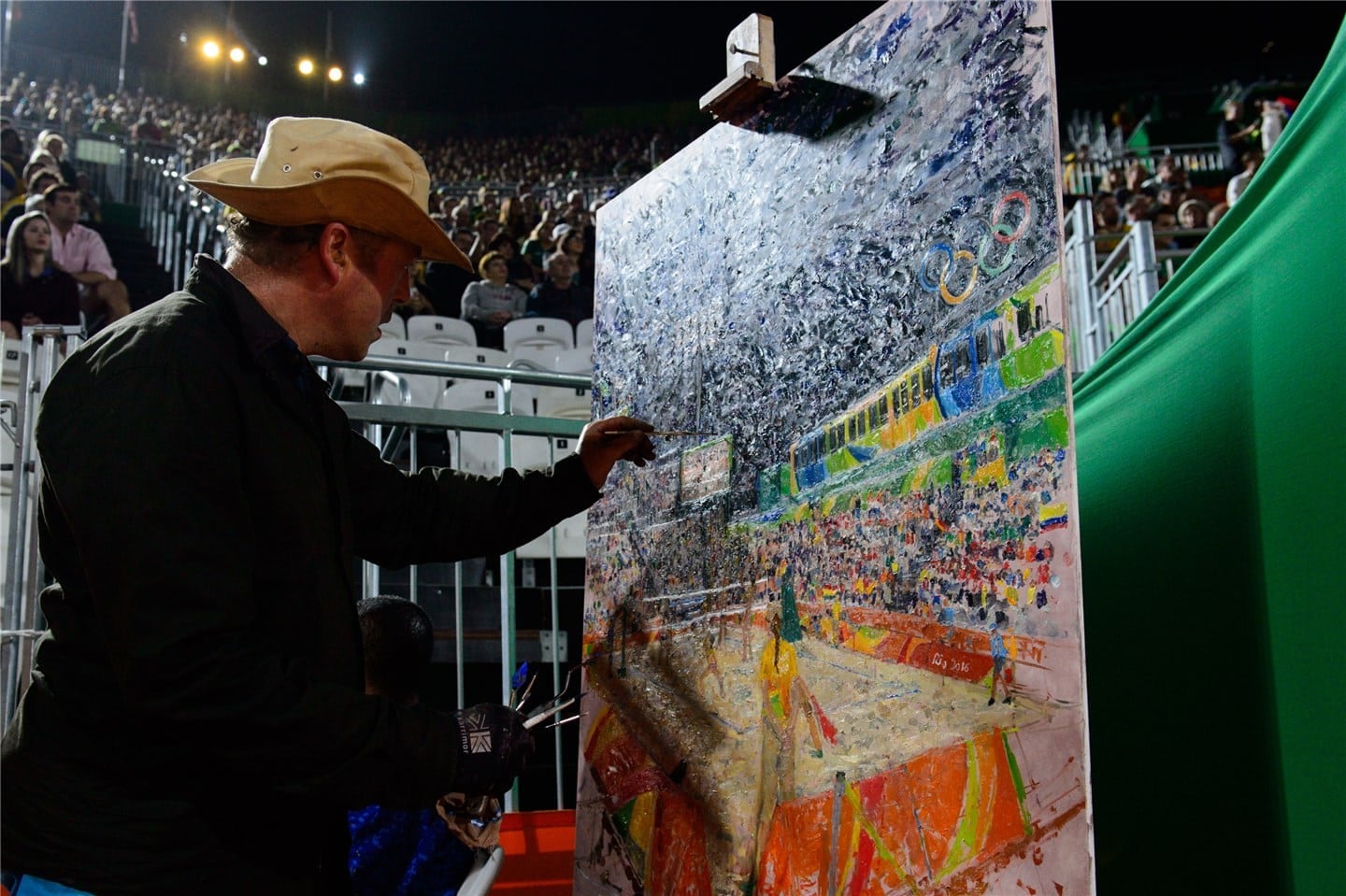 Peter Spens painting court side at the Rio Olympics 2016